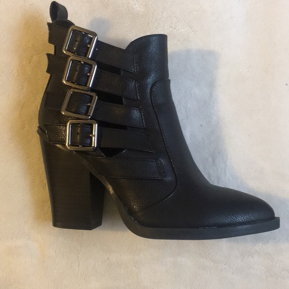 Black leathered boots.